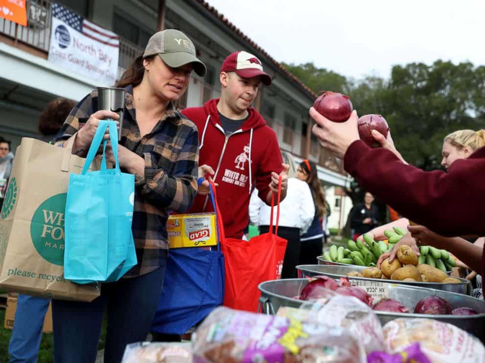 PHOTO: U.S. Coast Guard families receive fresh produce during a food giveaway on Jan. 19, 2019 in Novato, Calif.