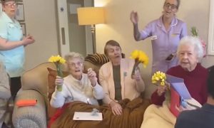 Watch the Heartwarming Moment Residents of Senior Home Sing ‘Que Sera Sera’ to Relatives From the Window
