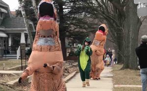Watch Neighborhood Come Together for Hilarious Dino-Themed Social Distancing Parade Watch Neighborhood Come Together for Hilarious Dino-Themed Social Distancing Parade